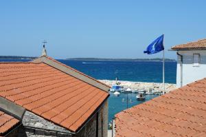 a view of a harbor with boats in the water at Apartment Etta in Fažana