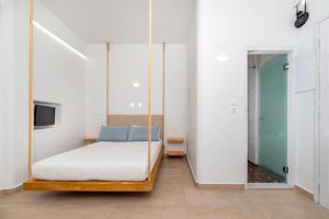Ένα ή περισσότερα κρεβάτια σε δωμάτιο στο Hotel Thira