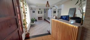 a lobby with a reception desk and a fireplace at Hotel Sebari in Villa Carlos Paz