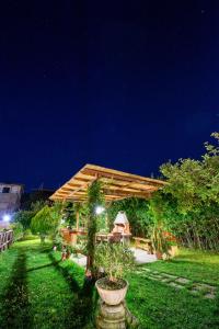 a pavilion in a garden at night at B&B La Casa Nel Giardino in Piano di Sorrento