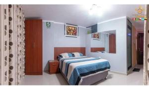 Un pat sau paturi într-o cameră la HOTEL TERRA