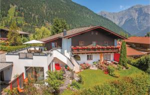 an aerial view of a house in the mountains at Beautiful Apartment In Saalfelden With Wifi in Saalfelden am Steinernen Meer