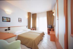 Postel nebo postele na pokoji v ubytování Hotel degli Ulivi + 37 fotografií