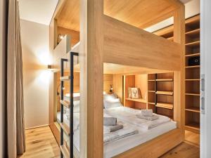 Rúm í herbergi á The Tauplitz Suites - Mountain Suite A2