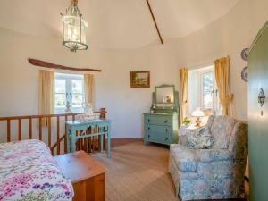 a bedroom with a bed and a chair and a table at 1 bed property in Mattishall Norfolk MILN8 in Mattishall