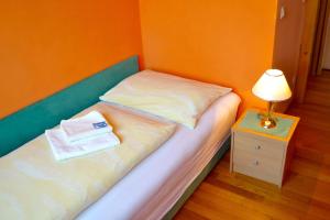 Postel nebo postele na pokoji v ubytování Gasthof Redl