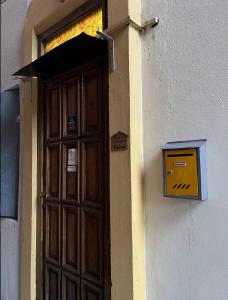 a door to a building with a box on it at Kristina NS in Novi Sad +2 photos