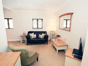 a living room with a couch and a table at 1 bed in Crickhowell 42953 in Llangattock