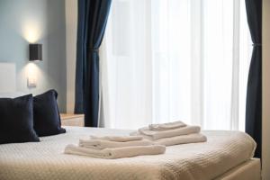 Postel nebo postele na pokoji v ubytování Almarea B&B Trani