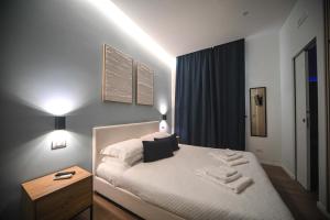 Postel nebo postele na pokoji v ubytování Almarea B&B Trani
