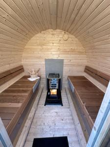 an inside of a sauna with a stove in it at The Zen Nest in Geel