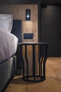 Postel nebo postele na pokoji v ubytování DOLOMITI EXCLUSIVE YOUR MOUNTAIN SUITE