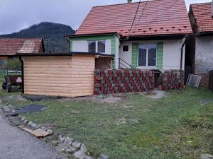 a house with a fence in front of it at privatno117 in Lúčky