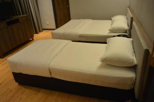 Postel nebo postele na pokoji v ubytování Go Hotel