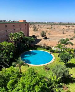 an overhead view of a swimming pool in a field at Peaceful Apartment: Hivernage,Guéliz in Marrakesh