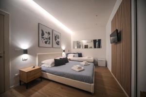Postel nebo postele na pokoji v ubytování Almarea B&B Trani