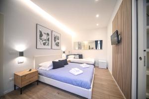 Postel nebo postele na pokoji v ubytování Almarea B&B Trani