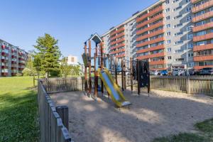a playground in a park with a slide at convenient and comfortable accommodation in Tallinn