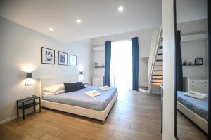 Postel nebo postele na pokoji v ubytování Almarea B&B Trani