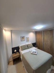 Ένα ή περισσότερα κρεβάτια σε δωμάτιο στο ECOSUMMER FLATS TAMBAÚ - Flat na praia de Tambaú