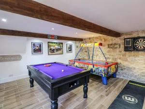 a game room with a pool table and a game table at Orchard Retreat in Crediton