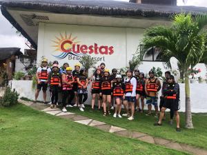 a group of people standing in front of a building at Cuestas Beach Resort and Restaurant in Badian
