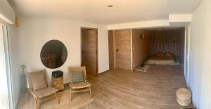 Ένα ή περισσότερα κρεβάτια σε δωμάτιο στο Chambre d’inspiration japonaise