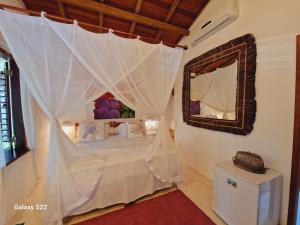 Vuode tai vuoteita majoituspaikassa Mini Casa com Jacuzzi e Piscina