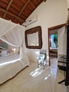 Vuode tai vuoteita majoituspaikassa Mini Casa com Jacuzzi e Piscina