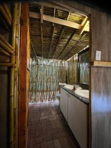 a bathroom with a sink and a toilet in it at Sandton Safari Camp in Johannesburg