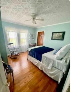 a bedroom with a bed and a ceiling at Lazy Dog Acres 