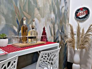 a table with two bottles of wine on it at La casa di Vale in Bari