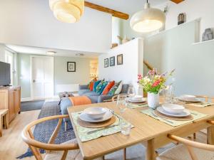 a dining room and living room with a table and chairs at 2 Bed in Taunton 88884 in Isle Brewers
