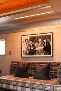 a couch in a room with a picture on the wall at The Verb Hotel in Boston