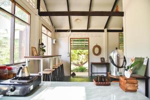 a kitchen with a counter and some windows at CoCoCo in Ko Phayam