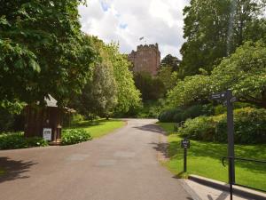 a road in a park with a building in the background at 3 bed in Minehead TRINI in Minehead