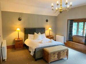 a bedroom with a bed with two teddy bears on it at Daweswood, Patterdale in Patterdale