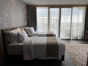 Postelja oz. postelje v sobi nastanitve Tabebuya Resto & Resort