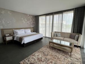 Postelja oz. postelje v sobi nastanitve Tabebuya Resto & Resort