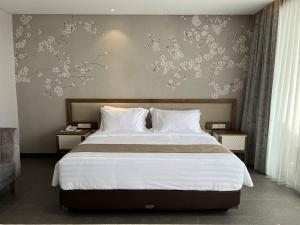 Postelja oz. postelje v sobi nastanitve Tabebuya Resto & Resort