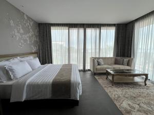 Postelja oz. postelje v sobi nastanitve Tabebuya Resto & Resort