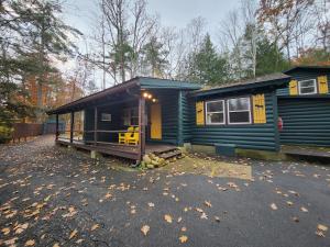 a blue tiny house sitting in a parking lot at Adirondack Diamond Point Lodge in Lake George