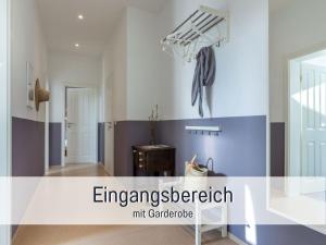 a room with blue and white stripes on the wall at Bio Ferienhof Wichtelweide - Fewo Lavendel in Fehmarn +45 photos