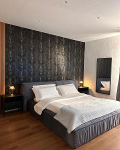 Un pat sau paturi într-o cameră la Residenza Ricci & Spa