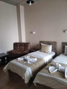 Voodi või voodid majutusasutuse Magic Hotel toas