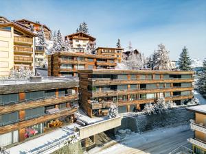 an aerial view of a hotel in the snow at Salis 06 by Arosa Holiday in Arosa