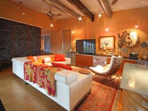 a living room with a white couch and a chair at The Haven by Lodgewell - Where serenity meets sanctuary in Austin