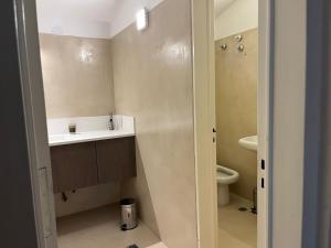 a bathroom with a sink and a toilet at Casa Cerro de las Rosas in Cordoba