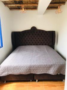 Ein Bett oder Betten in einem Zimmer der Unterkunft YAKY'S TOPARA