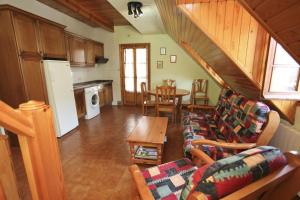 a living room with a couch and a table at Casa Rural Hortal in Barruera